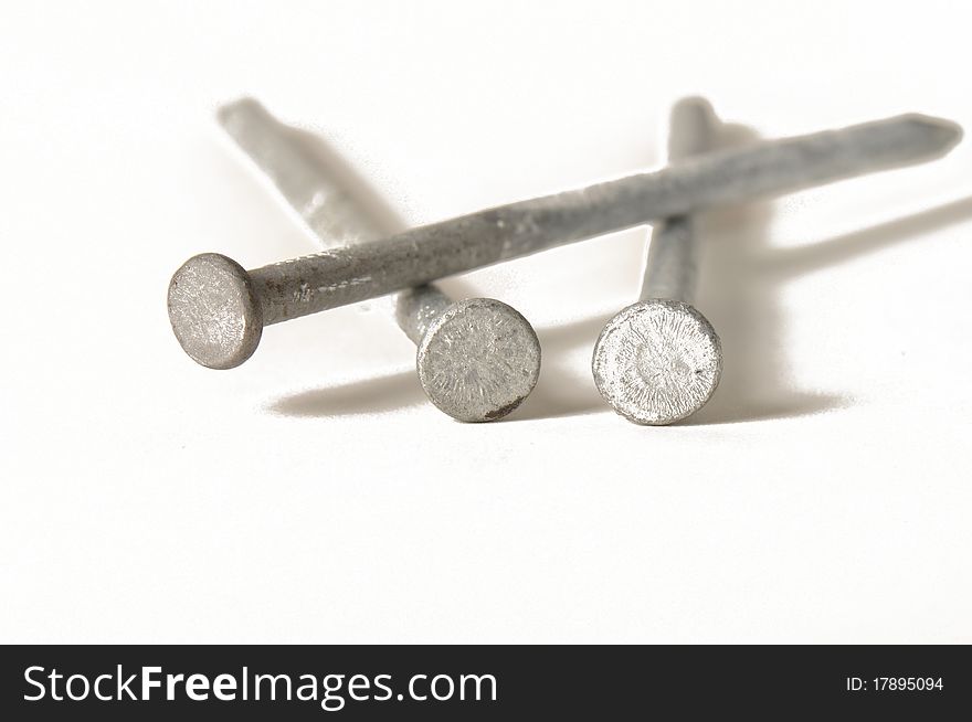 Three nails on a white background