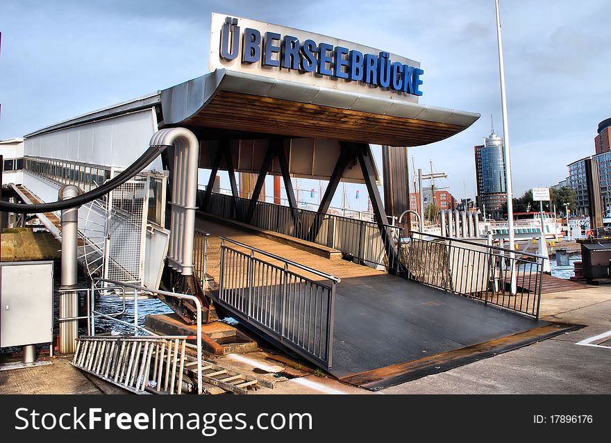 An opening to a footbridge located at the Port of Hamburg in Germany. An opening to a footbridge located at the Port of Hamburg in Germany