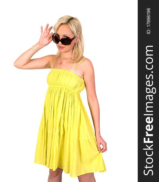 Girl in a yellow summer dress and sunglasses isolated on white background. Girl in a yellow summer dress and sunglasses isolated on white background