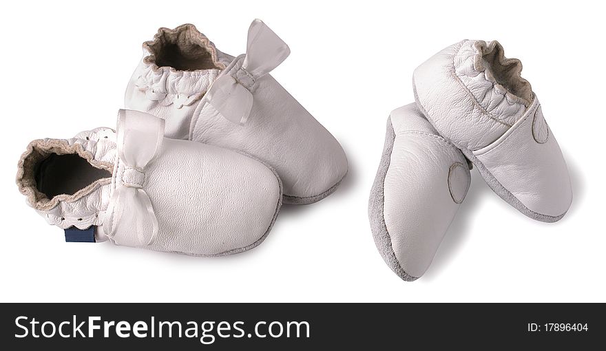 Leather baby shoes over white background. Leather baby shoes over white background.