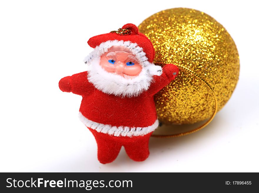 Father Christmas teddy bear with decorative ball isolated on white background.