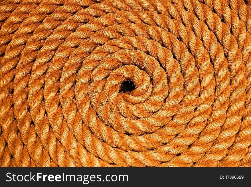 A spiraled coil of braided rope. A spiraled coil of braided rope