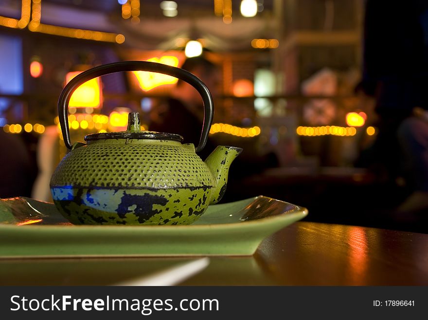Green cast-iron teapot