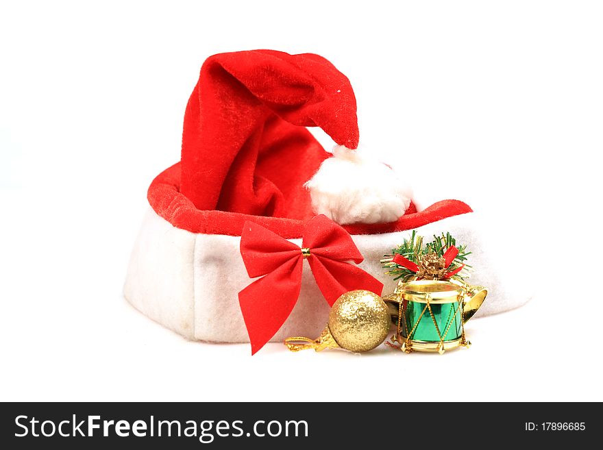 Santa claus cap with decoration items isolated on white background.