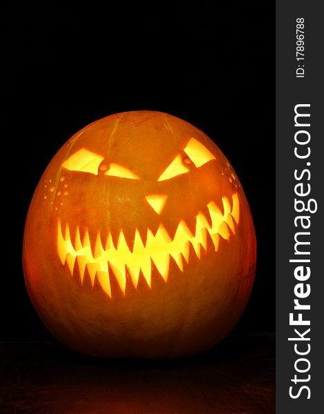 A halloween pumpkin with lighting. A halloween pumpkin with lighting