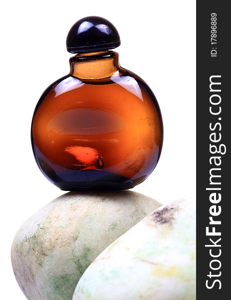 Brown scent bottle isolated over white background.