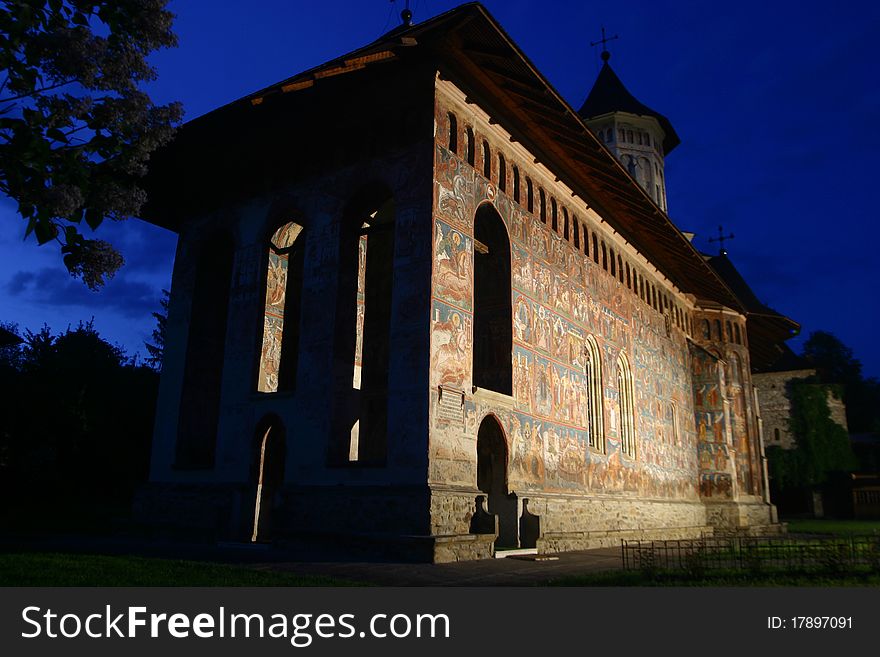 Moldovita monastery by night, on a blue sky