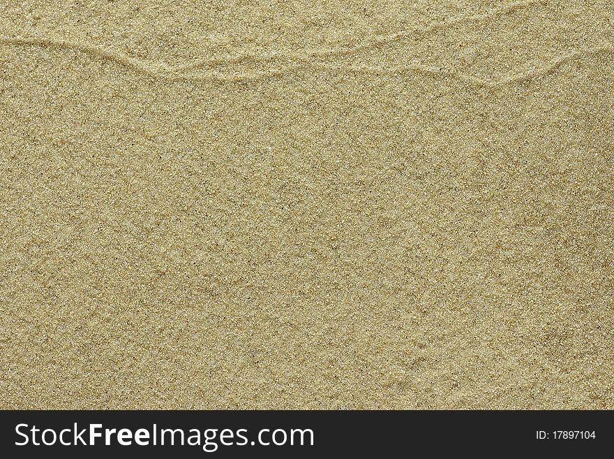 Fine-grained sand with simple watermark texture on top for background. Fine-grained sand with simple watermark texture on top for background