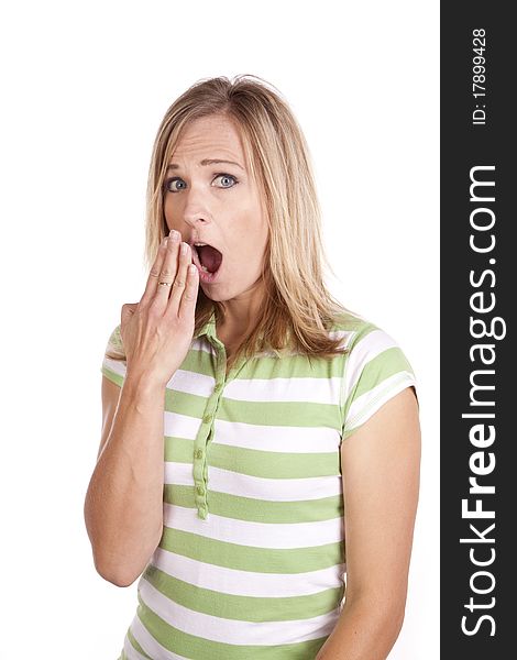 A woman in a green and white striped shirt making a face expression of being shocked. A woman in a green and white striped shirt making a face expression of being shocked.
