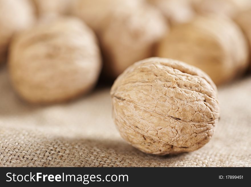 Walnuts close-up on the sackcloth background