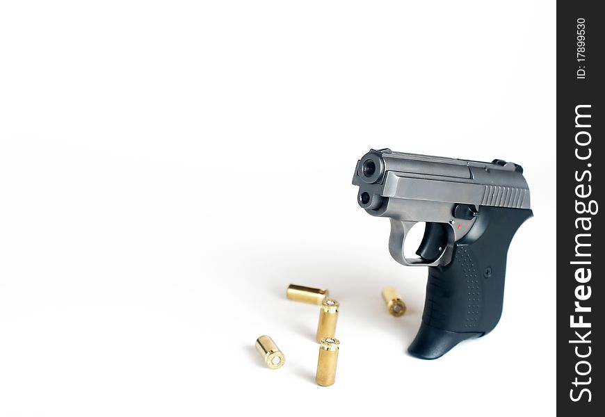 Five bullets and handgun with place for text. Five bullets and handgun with place for text