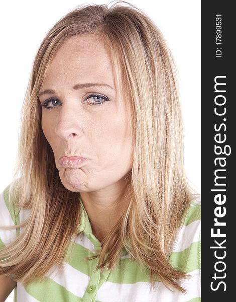 A woman in a green and white striped shirt making a face expression of sadness. A woman in a green and white striped shirt making a face expression of sadness.