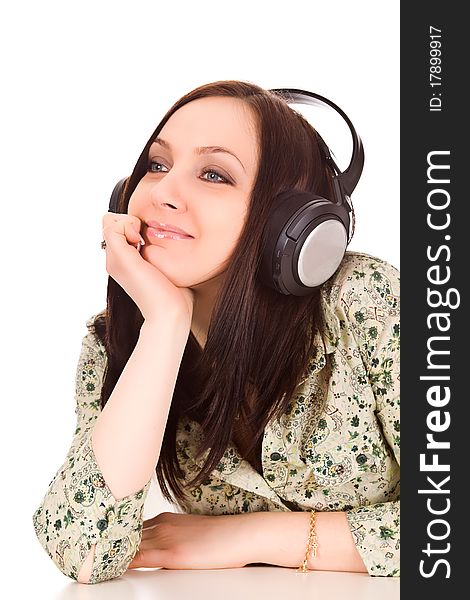 Photo of cute woman with headphones is listening to musc