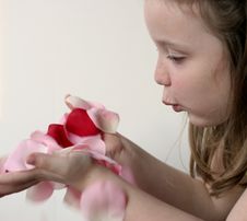 Girl Blowing Rose Petals 3 Stock Images Girl Blowing Rose Petals 3 Stock Images