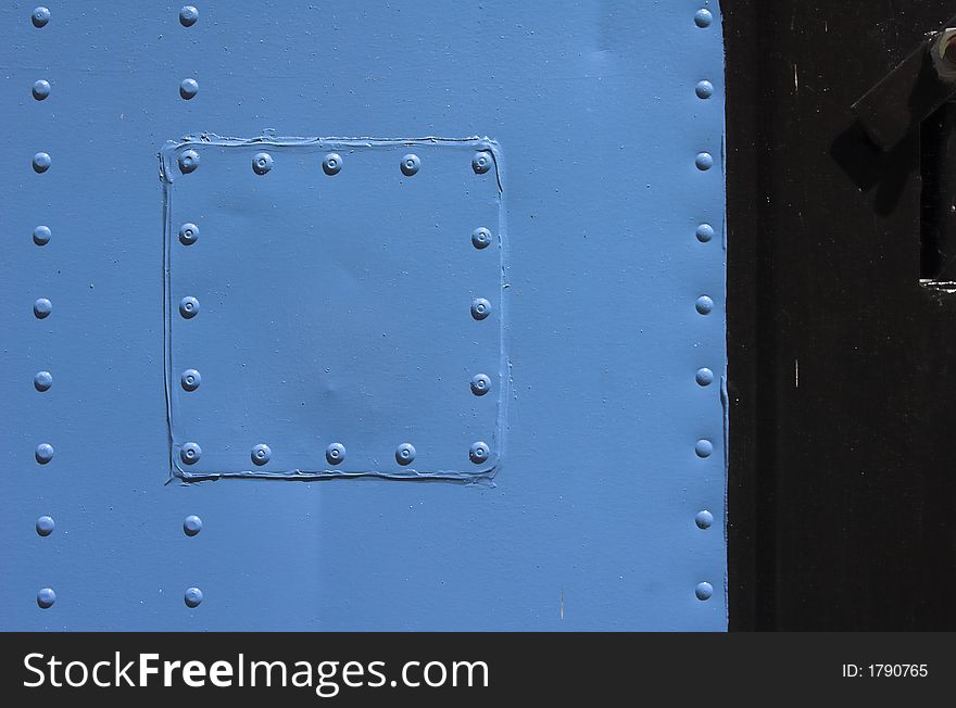 Detail from an blue container with rivets. Detail from an blue container with rivets