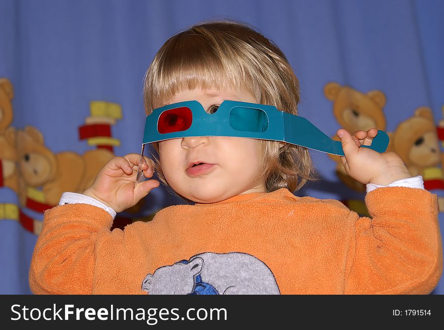 Two year old girl playing with anaglyph glasses. Two year old girl playing with anaglyph glasses