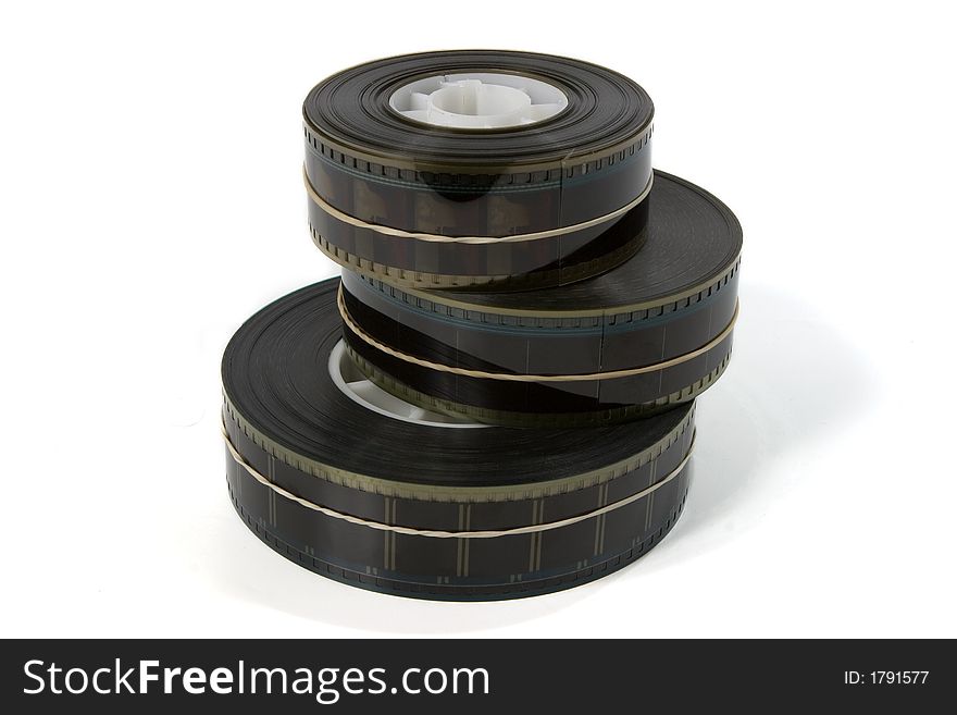 A stack of three 35mm movie film trailers - on white. A stack of three 35mm movie film trailers - on white