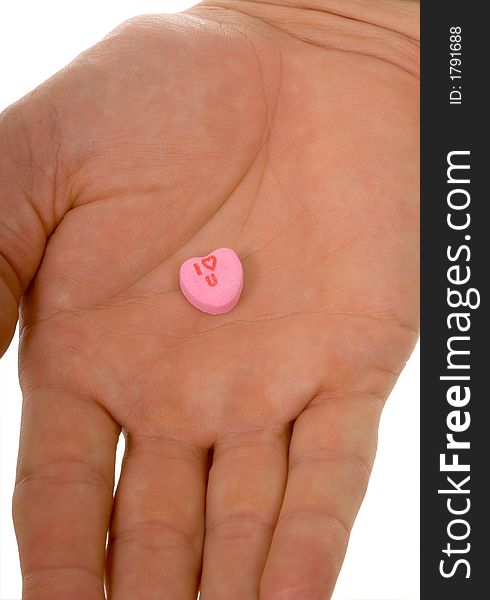 Open hand holding I Love you Candy heart - conversation heart