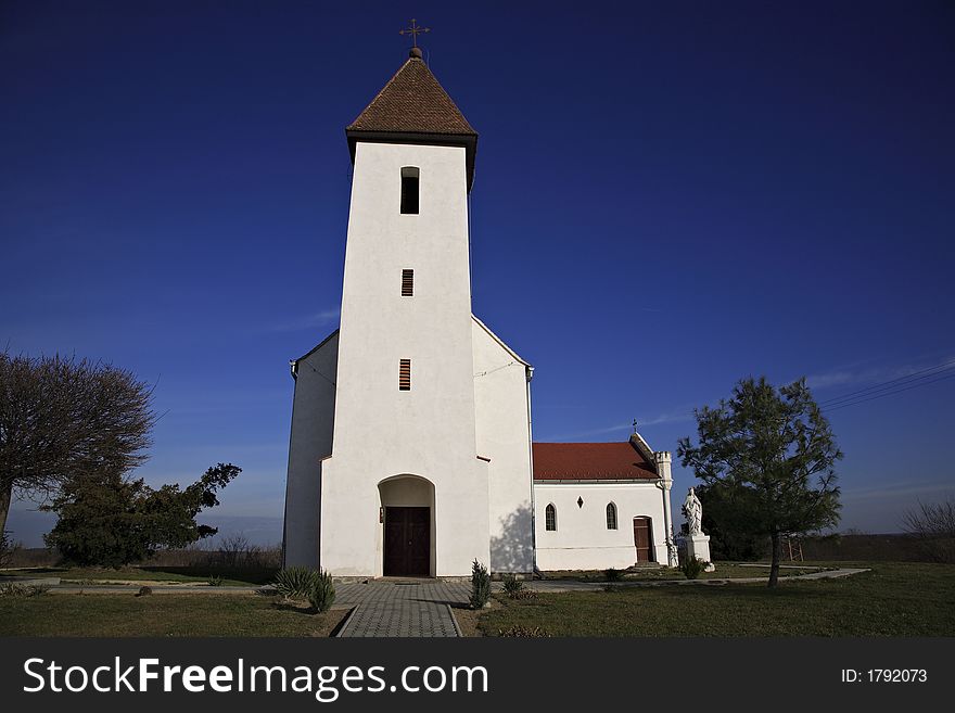 Small villager church with white walls