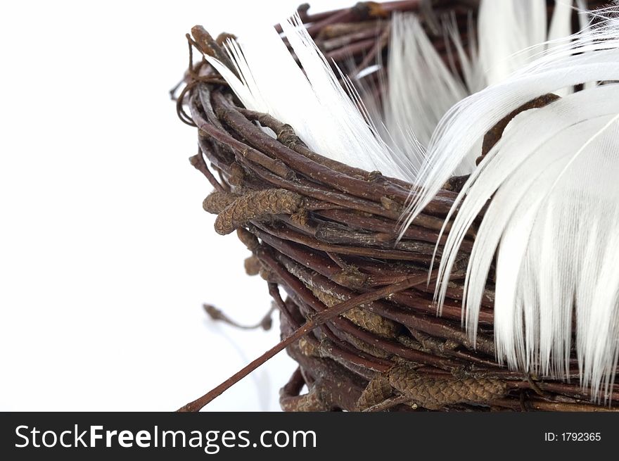 Bird nest with feathers. isolated on the white background