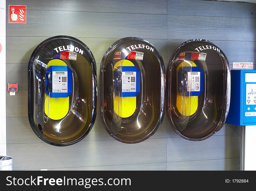 3  public phone boxes at the airport