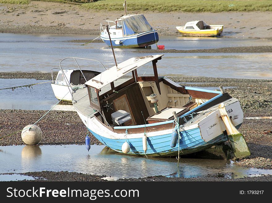 Boats moored at mouth of tidal river in Shoreham, Sussex. Boats moored at mouth of tidal river in Shoreham, Sussex