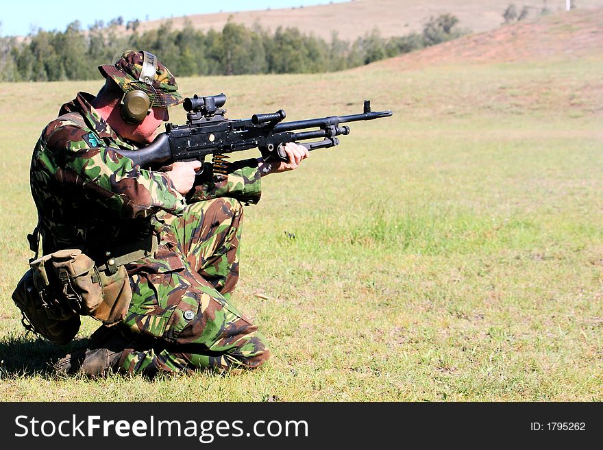 A machine gunner takes aim on the range