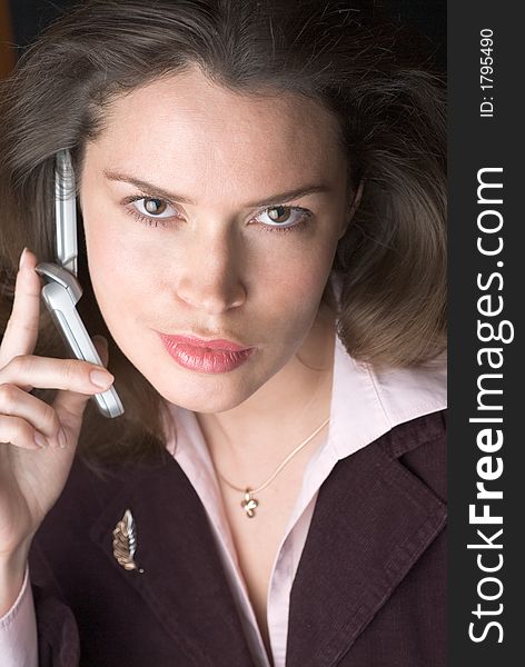 Pretty brunette secretary with telephone headset. Pretty brunette secretary with telephone headset