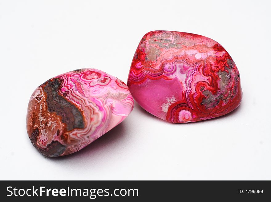Picture of  a couple red polished stones. Picture of  a couple red polished stones