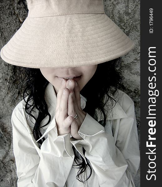 Girl wearing hat covering eyes