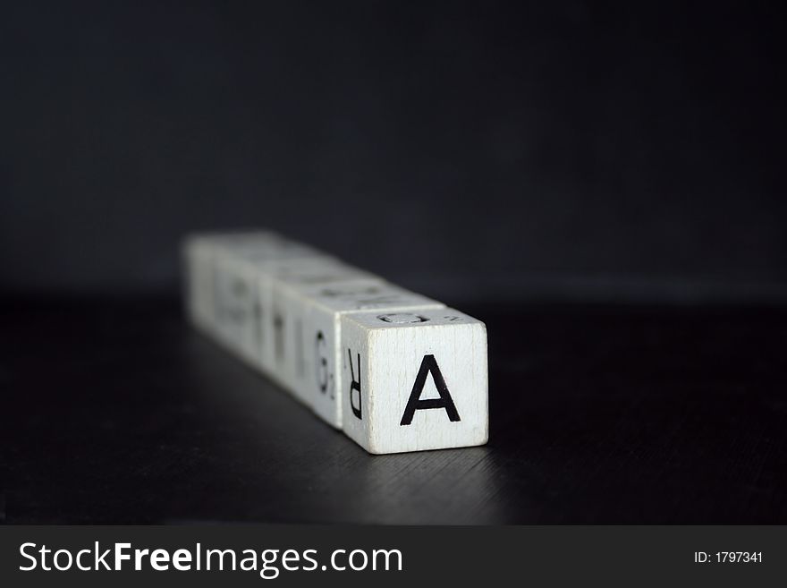 Cubes with letters on a black background. Cubes with letters on a black background