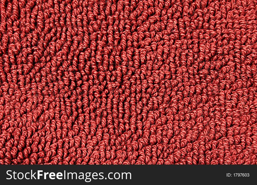 Piece of red terry towel close-up for background. Piece of red terry towel close-up for background