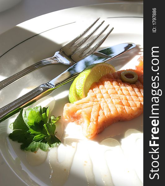 Delicious fish fillet with lemon and dressing