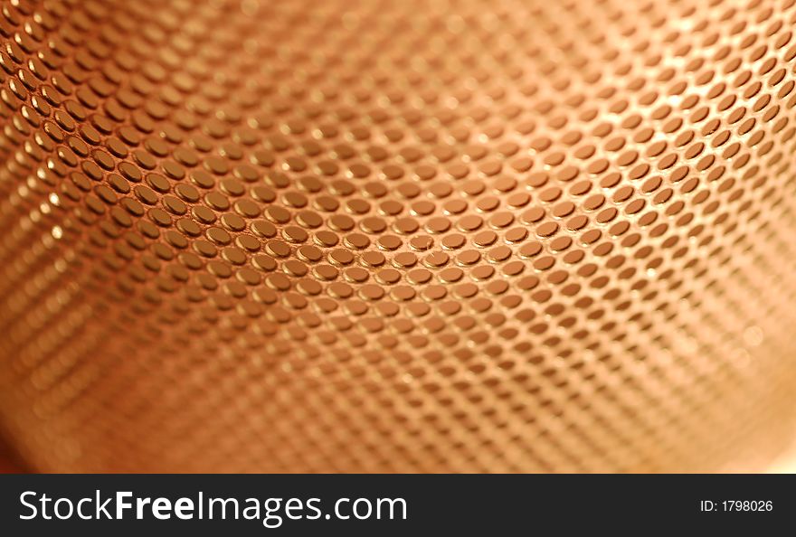 Macro view of perforated holes with red background. Macro view of perforated holes with red background