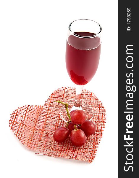 Glass Of Red Wine On A Background Of Heart