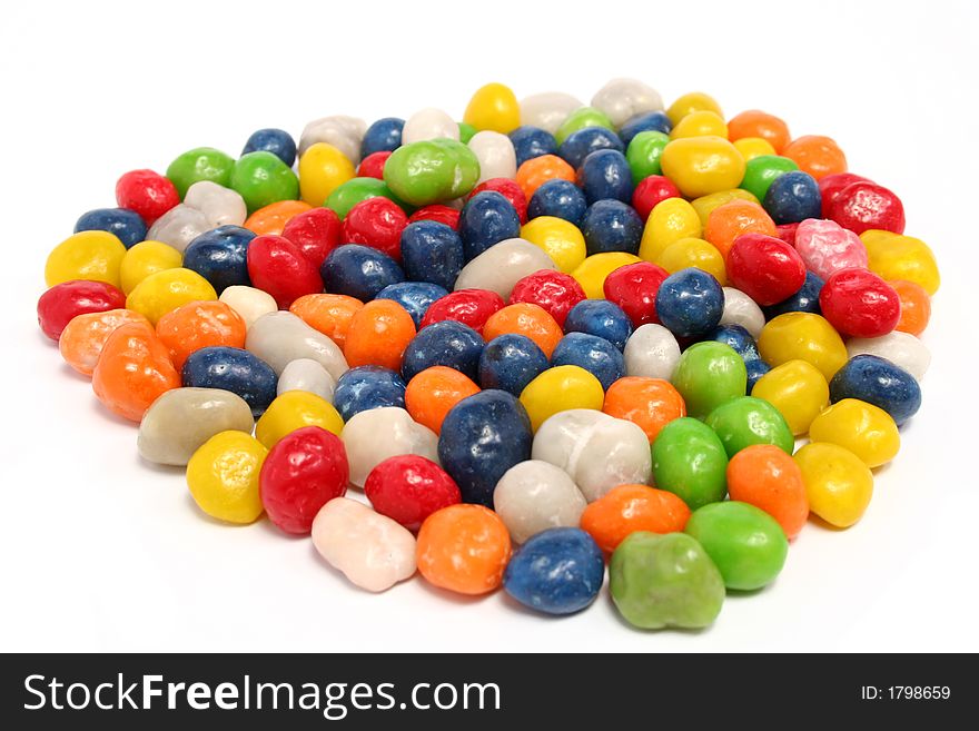 Heart made of multi-coloured sweets with raisin 2, isolated on white, (look similar images in my portfolio)