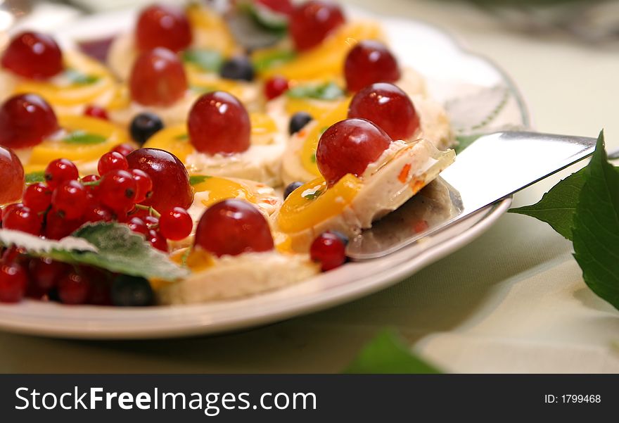 Cake with cherries on the white plate