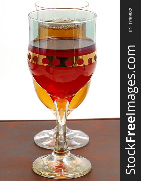Glasses of wine on a dark brown background