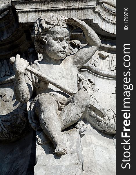 Close up of a granite carved child (1865)  - Place du Mal Lyautey - Lyon - France. Close up of a granite carved child (1865)  - Place du Mal Lyautey - Lyon - France