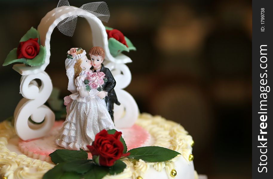 Weeding cake with girl and boy figurines on top. Weeding cake with girl and boy figurines on top