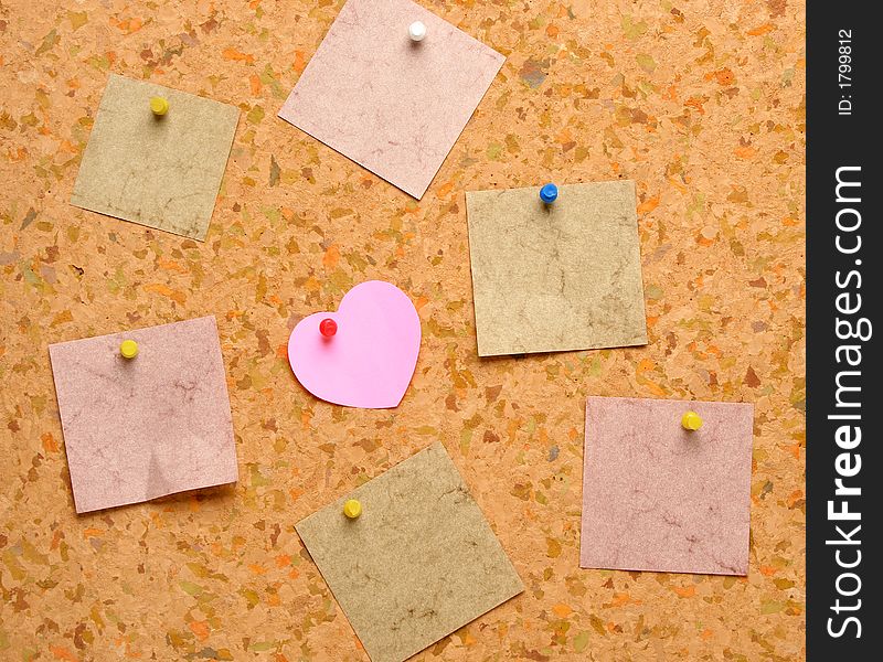 Cork board with heart shape sticky note. Cork board with heart shape sticky note