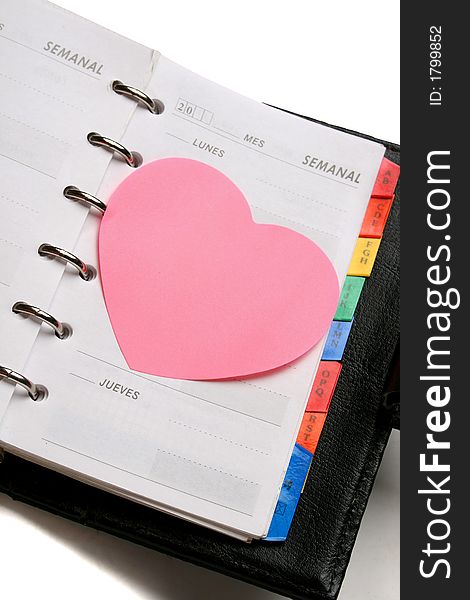 Dairy planer with heart shape sticky note. Dairy planer with heart shape sticky note