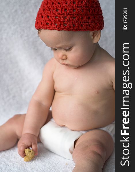 Image of baby eating a cookie. Image of baby eating a cookie