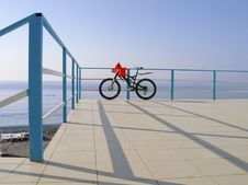 Alone Bicycle At The Seafront Fence In Sunny Day Royalty Free Stock Photography Alone Bicycle At The Seafront Fence In Sunny Day Royalty Free Stock Photography