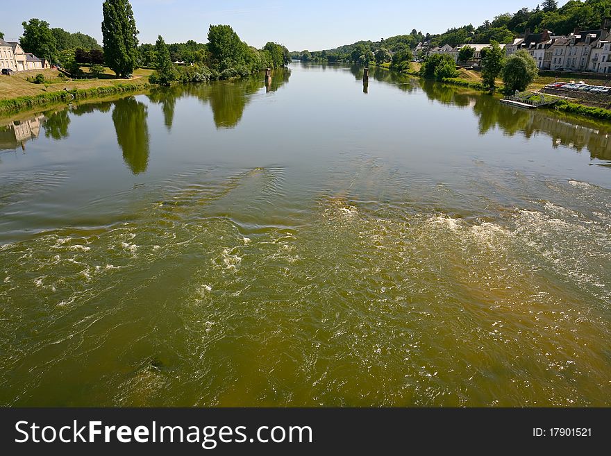 Wide, but not deep river in summer day (Loire river in France)