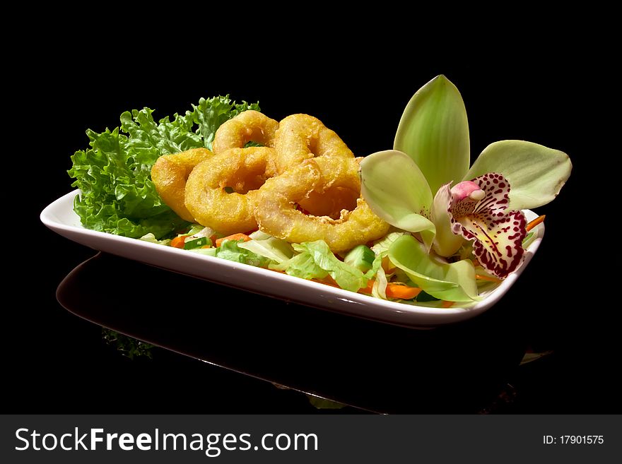 Dinner shrimp tempura on a small white plate. Dinner shrimp tempura on a small white plate