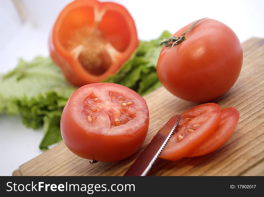 tomatoes on a wooden board
