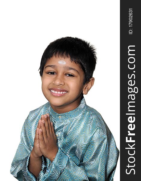 An handsome indian kid smiling for you