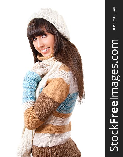 young woman dressed in a sweater, scarf and cap isolated over white. young woman dressed in a sweater, scarf and cap isolated over white