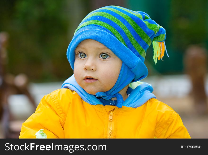 Sweet baby boy in park